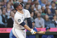 Seattle Mariners' Ty France reacts after popping out during the sixth inning of the team's baseball game against the Kansas City Royals, Tuesday, May 14, 2024, in Seattle. (AP Photo/Jason Redmond)