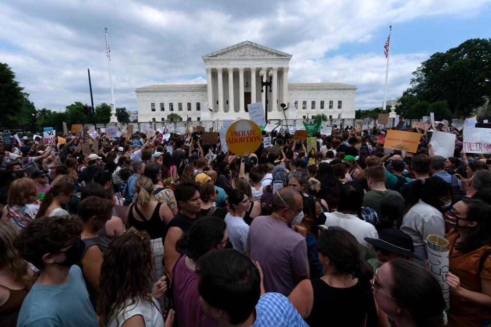 Abortion rights activists protest outside the Supreme Court in Washington, Friday, June 24, 2022.