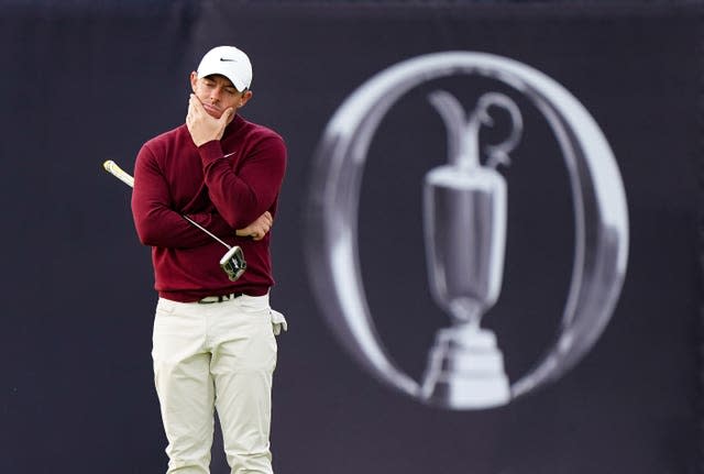 Rory McIlroy looks dejected in front of an image of the Claret Jug