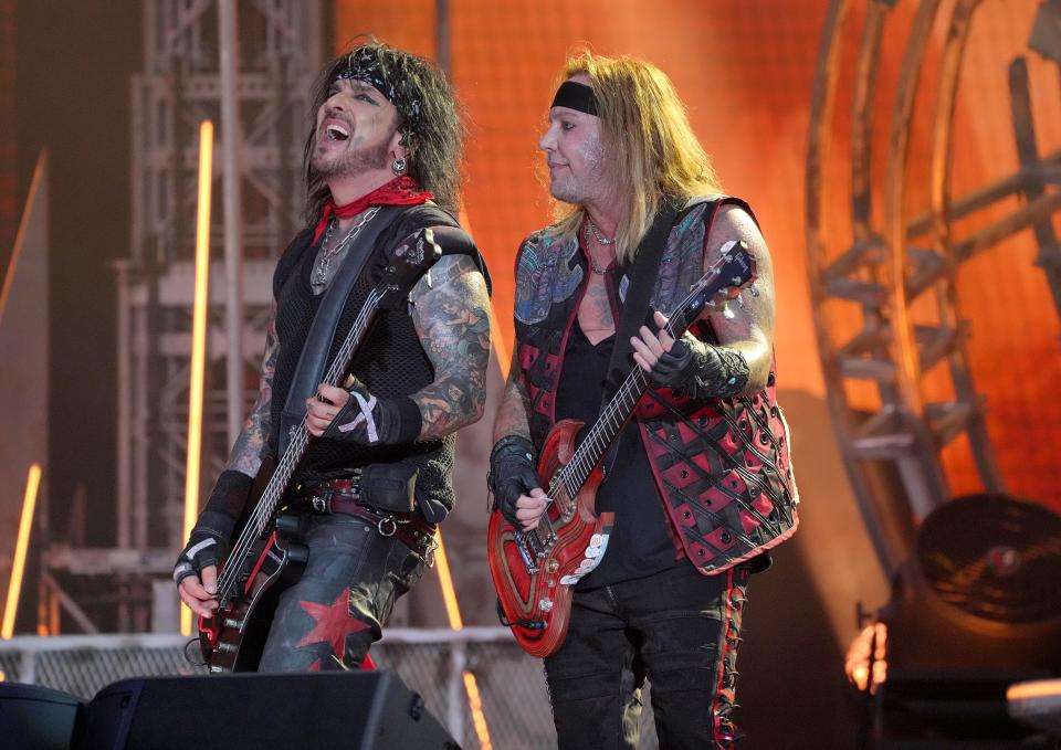Nikki Sixx and Vince Neil of Motley Crue perform onstage during The Stadium Tour at Truist Park on June 16, 2022 in Atlanta, Georgia.