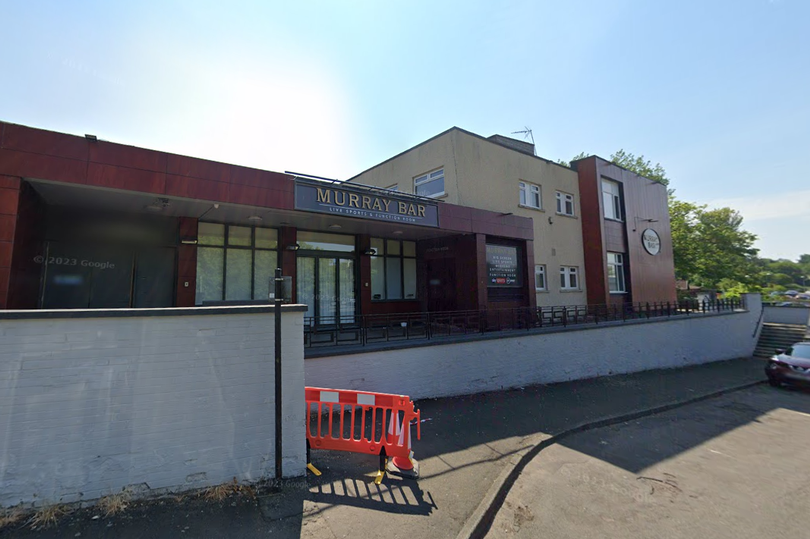 Bar staff found the young man at the back door "covered in blood"