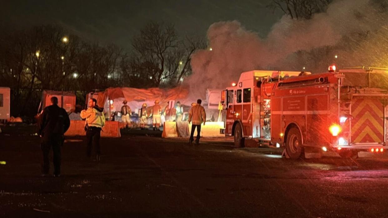 Firefighters responded to a fire inside a camp trailer at 5 a.m. Monday near a homeless shelter in Gatineau, Que. (Amadou Barry/Radio-Canada - image credit)