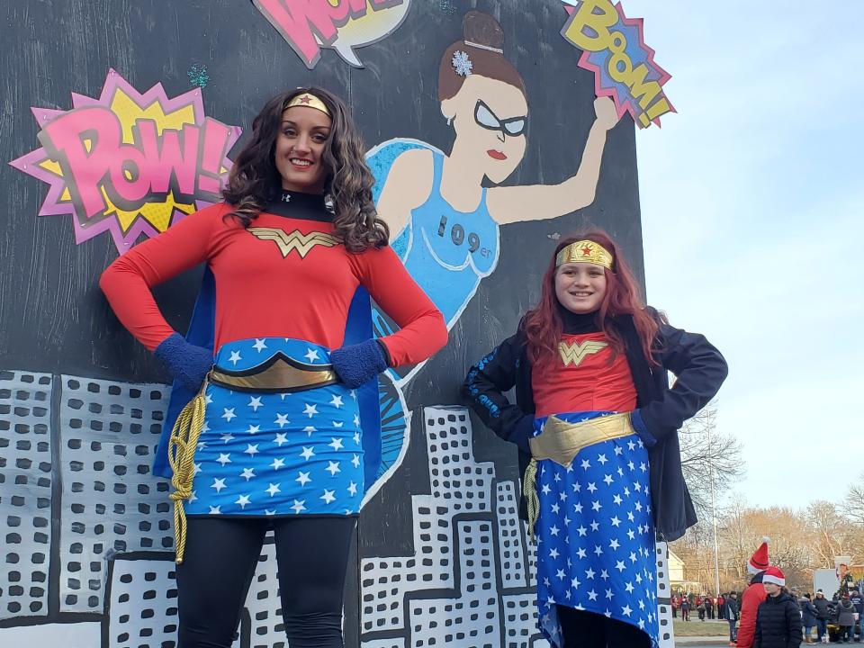 Wonder Woman and Wonder Girl of Studio 109, Josie Gillette and Keilee Carlson, during the Rochester Holiday Parade Sunday, Dec. 5, 2021.