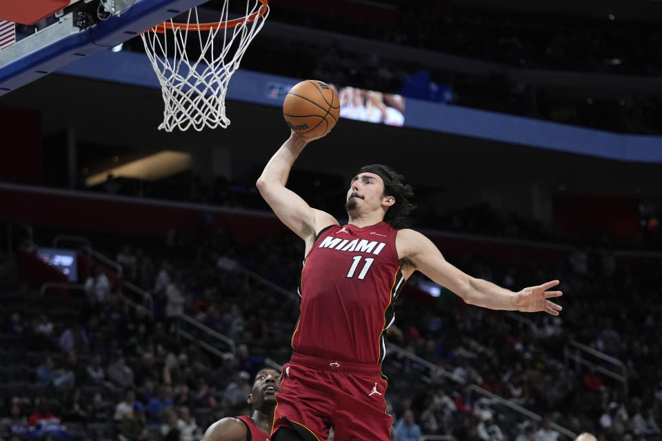 Miami Heat guard Jaime Jaquez Jr. (11) dunks on Detroit Pistons in the second half of an NBA basketball game in Detroit, Sunday, March 17, 2024. (AP Photo/Paul Sancya)