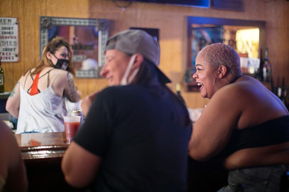 Lanée McNeal, right and Jackie Sansavera, left, sit at the bar at  Slammers, which is one of the last lesbian bars in the country, and the only one in Ohio, Wednesday, April 7, 2021. There are only 15 lesbian bars left in the country.