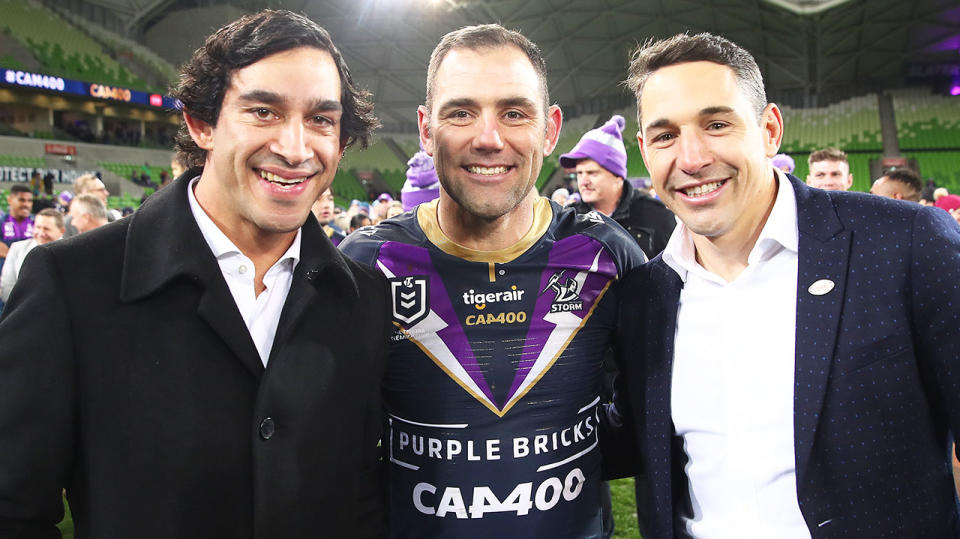 Cameron Smith (pictured middle) poses with Jonathan Thurston (pictured left) and Billy Slater (pictured right) after a game.