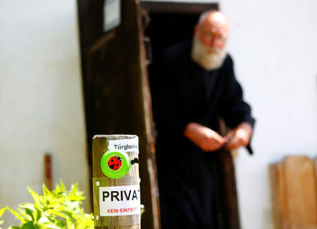 Hermit Stan Vanuytrecht of Belgium walks out of the hermitage in Saalfelden, Austria, May 22, 2017. Picture taken May 22, 2017. REUTERS/Leonhard Foeger