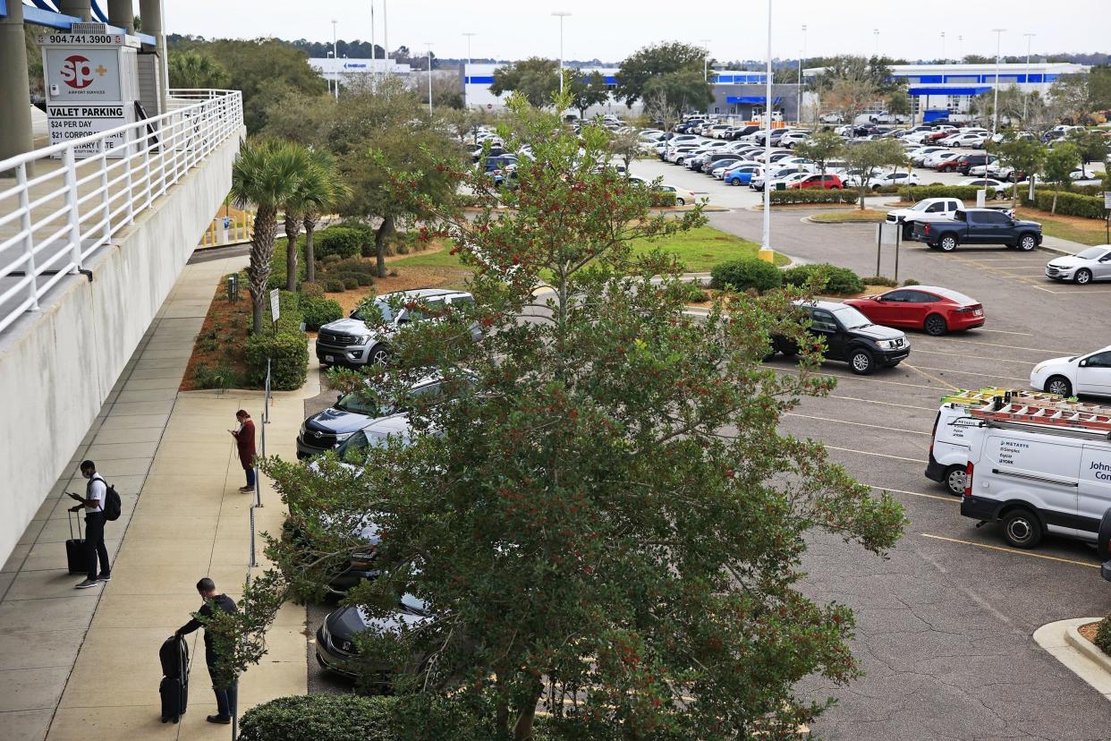 Travelers come and go at Jacksonville International Airport parking lots in early 2022. Tuesday the airport advised that most of its parking spots are at capacity.