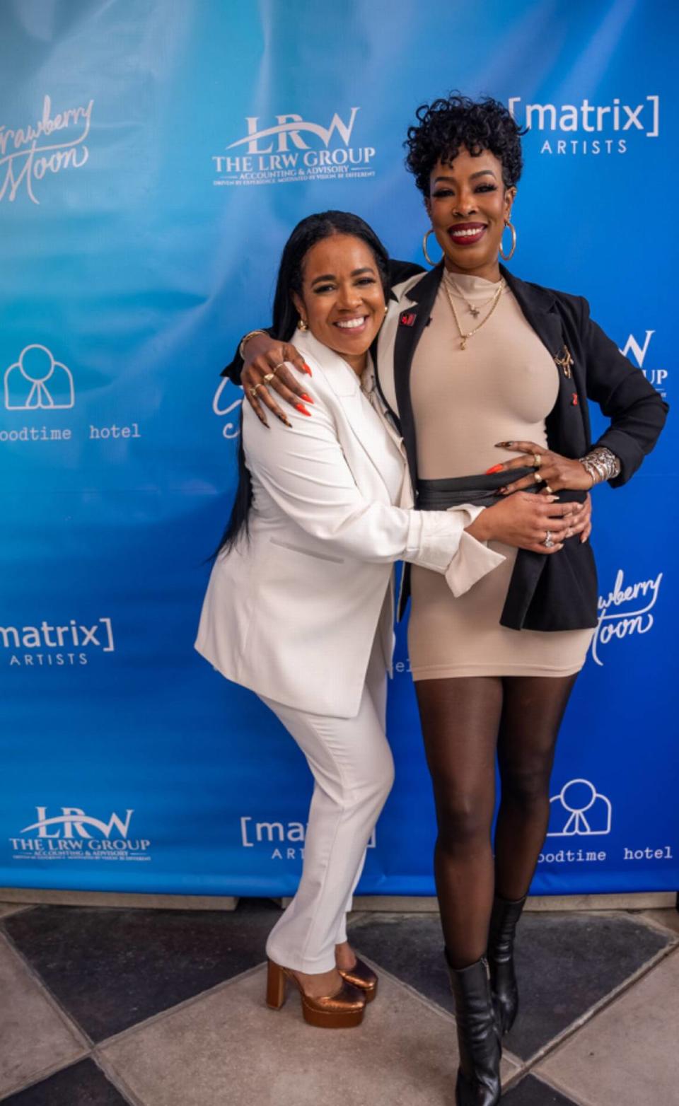Lahteefah Parramore, left, poses with her client Keema Chang, a Miami-based celebrity hairstylist and makeup artist.
