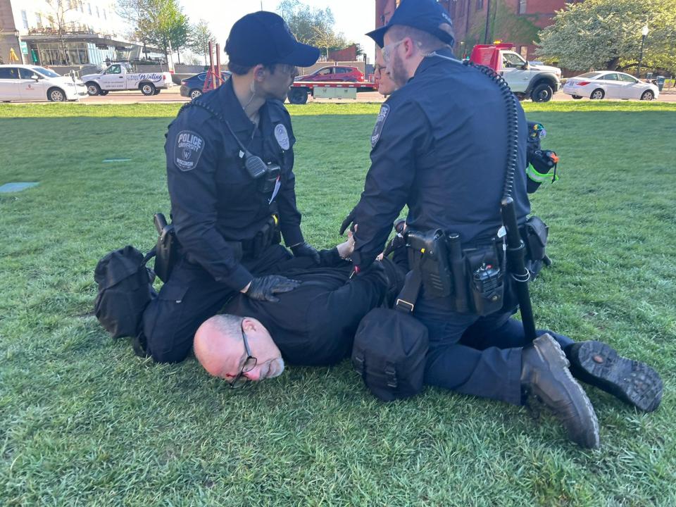 University of Wisconsin associate professor Samer Alatout is arrested Wednesday morning during protests on the UW-Madison campus.