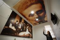 Hotel manager Emela Burdzovic points to a portrait of Austrian Archduke Franz Ferdinand on the ceiling at the Franz Ferdinand hostel in Sarajevo, January 29, 2014. REUTERS/Dado Ruvic