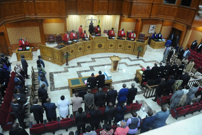 President of the Gabonese Constitutional Court Marie-Madeleine Mborantsuo (C) takes her seat ahead of a hearing at the Constitutional Court in Libreville