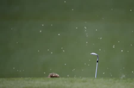 Bernhard Langer of Germany hits from a deep bunker on the seventh hole in first round play during the 2017 Masters golf tournament at Augusta National Golf Club in Augusta, Georgia, U.S., April 6, 2017. REUTERS/Lucy Nicholson