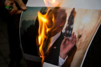 <p>Iranian demonstrators burn a picture of the U.S. President Donald Trump during a protest in front of the former U.S. Embassy on May 9, 2018 in Tehran, Iran. The protests were in response to President Donald Trump’s decision on Tuesday to pull out of the nuclear deal and renew sanctions. (Photo from Majid Saeedi/Getty Image) </p>