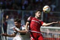 Football Soccer - FC Ingolstadt 04 v Bayern Munich - German Bundesliga - Audi Sportpark, Ingolstadt, Germany 07/05/16 Bayern Munich's Xabi Alonso goes for a header with FC Ingolstadt 04's Mathew Leckie. REUTERS/Michaela Rehle.