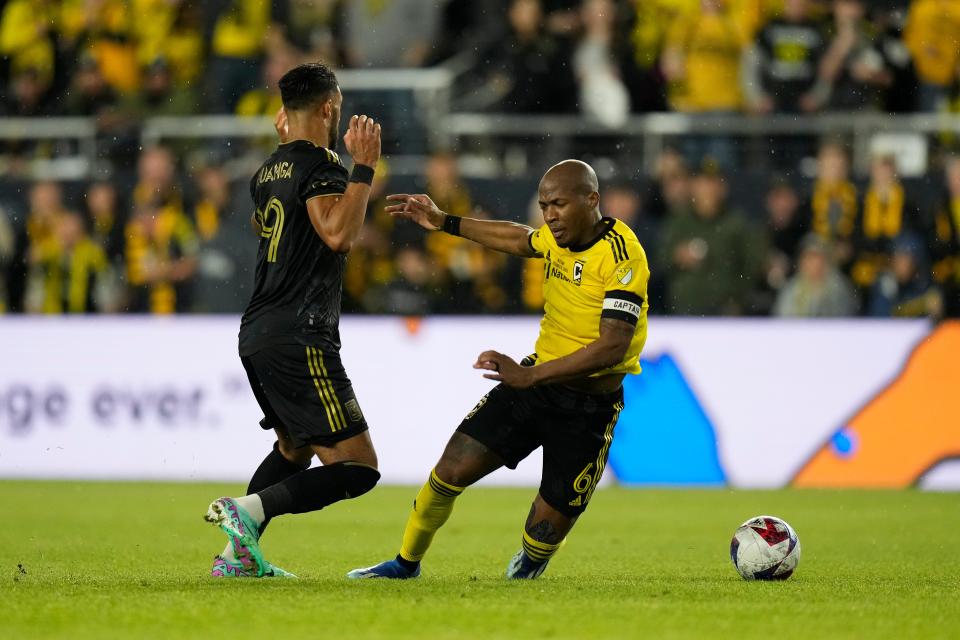 Dec 9, 2023; Columbus, OH, USA; Columbus Crew midfielder Darlington Nagbe (6) battles for the ball against Los Angeles FC forward Denis Bouanga (99) during the second half in the 2023 MLS Cup championship game at Lower.com Field. Mandatory Credit: Adam Cairns-The Columbus Dispatch