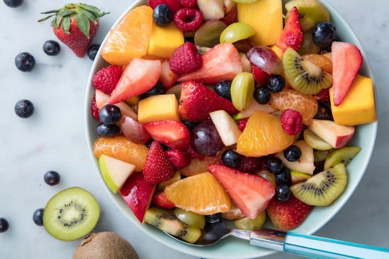 <p>A recipe for fruit salad? Yes, you need it. Because this simple dressing takes <a href="https://www.delish.com/cooking/g906/strawberry-desserts-round-up/" rel="nofollow noopener" target="_blank" data-ylk="slk:strawberries;elm:context_link;itc:0;sec:content-canvas" class="link ">strawberries</a>, raspberries, and <a href="https://www.delish.com/kitchen-tools/kitchen-secrets/a20143097/how-to-cut-a-mango/" rel="nofollow noopener" target="_blank" data-ylk="slk:mangoes;elm:context_link;itc:0;sec:content-canvas" class="link ">mangoes</a> to a whole new level. Sweet syrupy honey, fresh tart orange juice, and bright lemon zest come together to elevate your fruit (even if they're out of season) to new heights.<br><br>Get the <strong><a href="https://www.delish.com/cooking/recipe-ideas/a19609963/easy-fruit-salad-recipe/" rel="nofollow noopener" target="_blank" data-ylk="slk:Fruit Salad recipe;elm:context_link;itc:0;sec:content-canvas" class="link ">Fruit Salad recipe</a></strong>. </p>