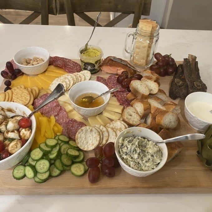 reviewer image of the board being used as a charcuterie board