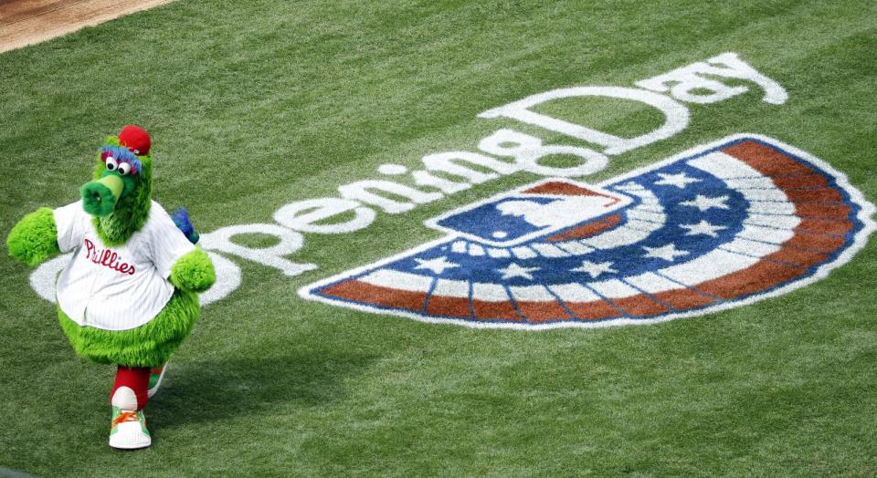 The Phillie Phanatic walks on the field for the Philadelphia Phillies' home opener baseball game against the Milwaukee Brewers in Philadelphia, Tuesday, April 8, 2014. (AP Photo/Chris Szagola)