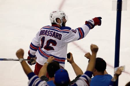 New York Rangers center Derick Brassard (16) celebrates his goal during the third period in game six of the Eastern Conference Final of the 2015 Stanley Cup Playoffs at Amalie Arena. Mandatory Credit: Reinhold Matay-USA TODAY Sports