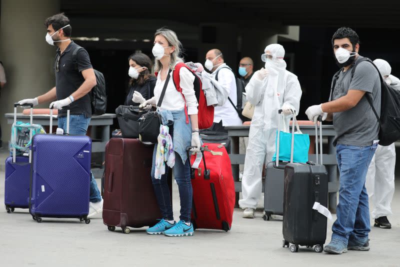 Lebanese people, who were stranded abroad by coronavirus lockdowns arrive at Beirut's international airport