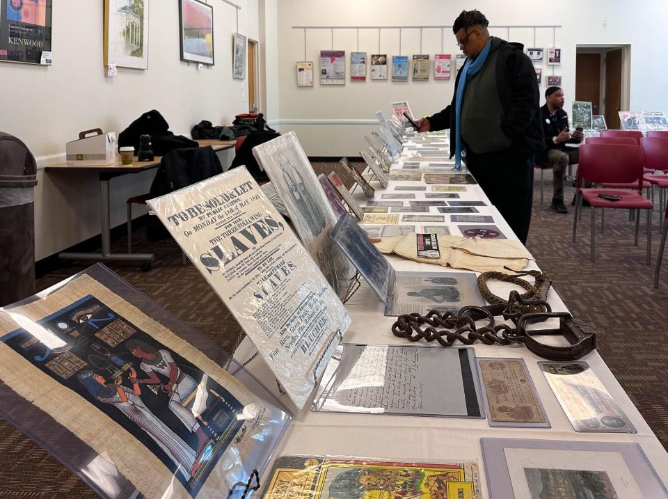 Ephemera and historical artifacts from the Black History 101 Mobile Museum on display Monday, Jan. 30 2023, at the East Lansing Public Library.  [Matthew Dae Smith/Lansing State Journal]
