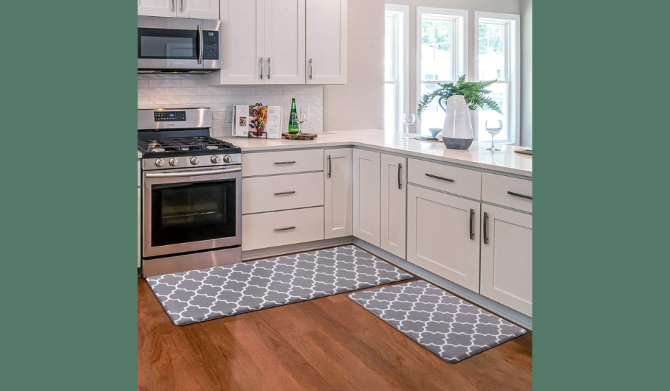 white kitchen with grey floor mats