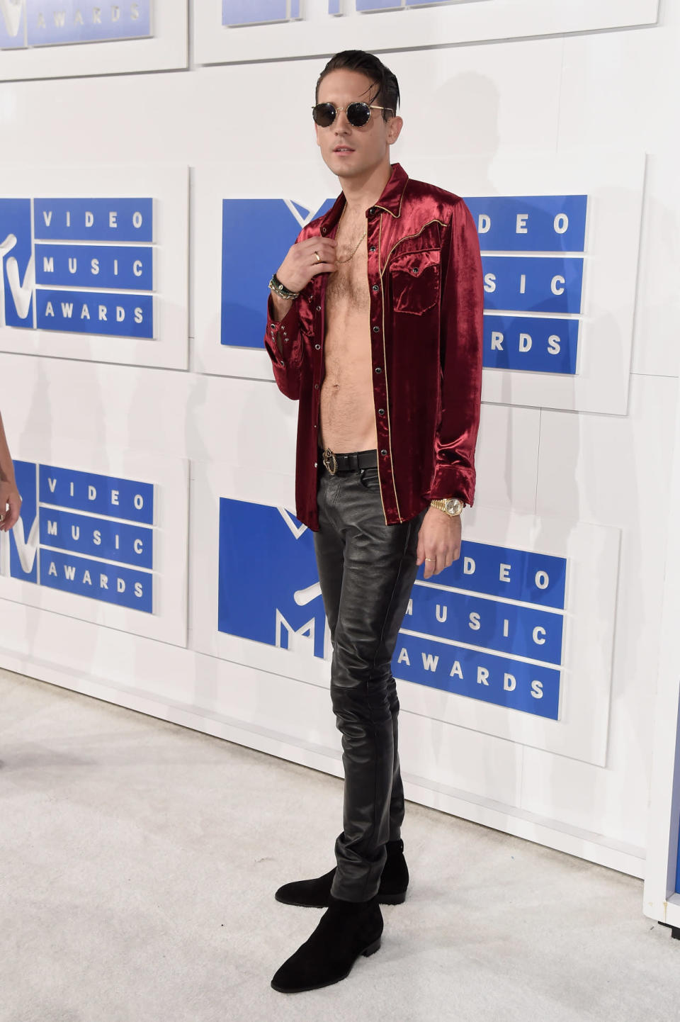 Rapper G-Eazy in a red velvet shirt he left unbuttoned. 