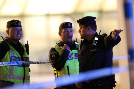 Police officers react at Landvetter Airport, which is evacuated after a bag was left near the information desk at the airport outside Gothenburg, Sweden, May 22, 2017. TT News Agency/Adam Ihse/via REUTERS