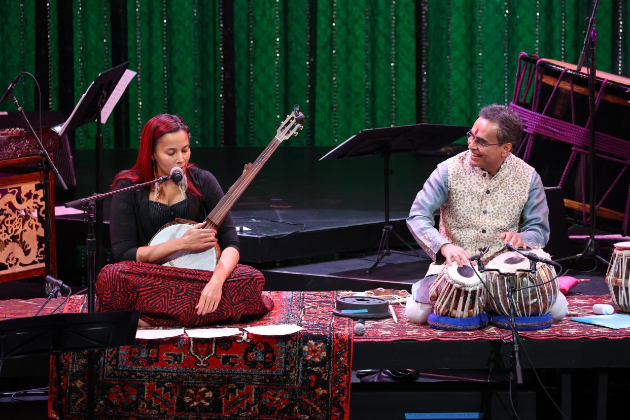 Rhiannon Giddens and Sandeep Das perform with the Silkroad Ensemble.