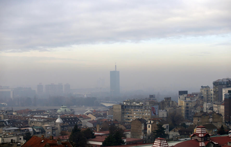 Fog and clouds blanket seen over Belgrade, Serbia, Friday, Dec. 7, 2018. The two-week U.N. climate meeting COP24 in Poland is intended to finalize details of the 2015 Paris accord on keeping average global temperature increases well below 2 degrees Celsius (3.6 Fahrenheit). (AP Photo/Darko Vojinovic)