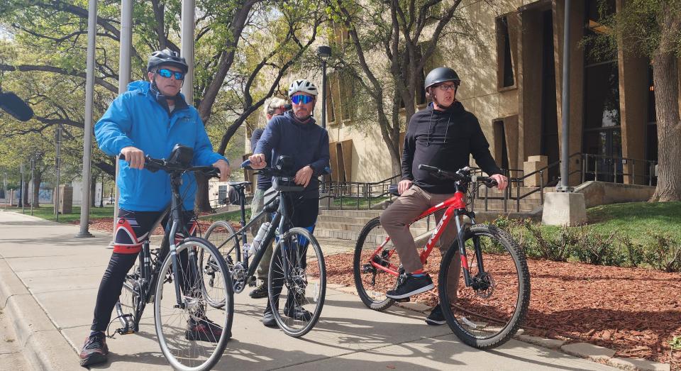 Jason Riddlespurger, right, Amarillo community development director, joins Ken Craft and Rowan Vansleve, the founder and president of Hope the Mission, on Monday at Amarillo City Hall.