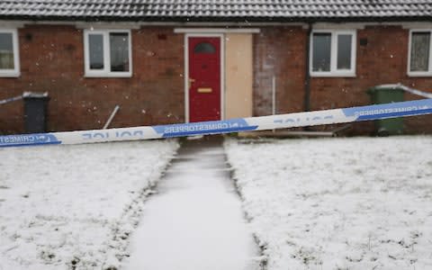 Police tape in front of house - Credit: Laura Dale/Caters News