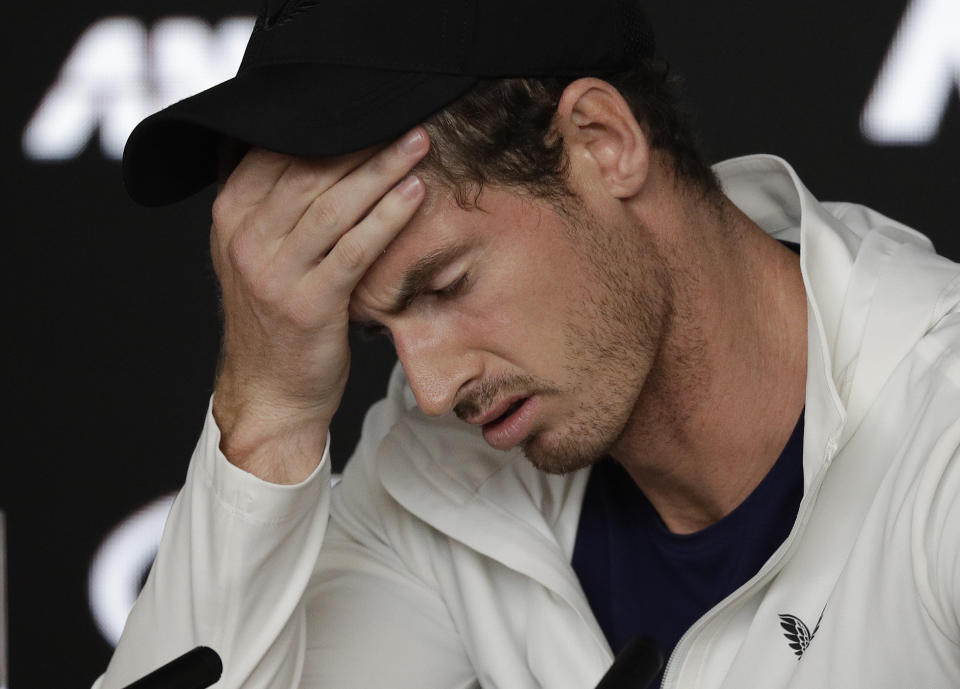 FILE - In this Tuesday, Jan. 15, 2019 file photo Britain's Andy Murray reacts during a press conference following his first round loss to Spain's Roberto Bautista Agut at the Australian Open tennis championships in Melbourne, Australia. Former world number one Murray's participation at the upcoming Australian Open is in doubt after the Briton tested positive for COVID-19. (AP Photo/Kin Cheung, File)