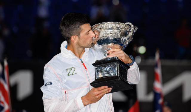 Novak Djokovic with the Australian Open trophy Credit: Alamy