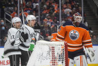 Los Angeles Kings' Lias Andersson (17) and Rasmus Kupari (89) celebrate a goal against Edmonton Oilers goalie Mikko Koskinen (19) during the first period of an NHL hockey game in Edmonton, Alberta, Sunday, Dec. 5, 2021. (Jason Franson/The Canadian Press via AP)