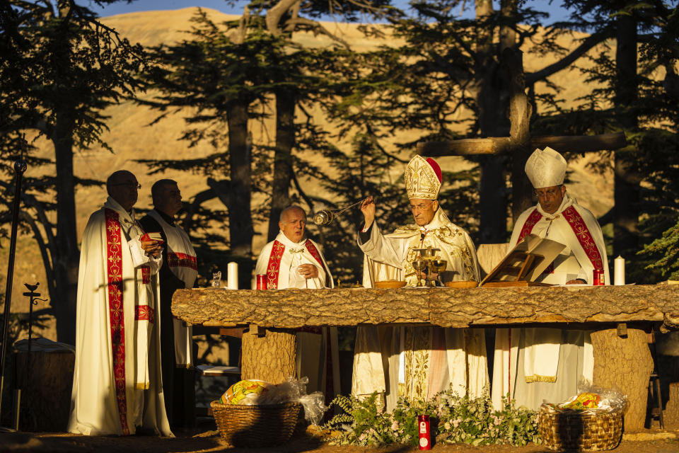 Lebanese Maronite Christian Patriarch Patriarch Beshara al-Rai, second right, leads the sermon to commemorate the Feast of the Transfiguration in the Cedars of God forest, in the northeast mountain town of Bcharre, Lebanon, Saturday, Aug. 5, 2023. For Lebanon's Christians, the cedars are sacred, these tough evergreen trees that survive the mountain's harsh snowy winters. They point out with pride that Lebanon's cedars are mentioned 103 times in the Bible. (AP Photo/Hassan Ammar)