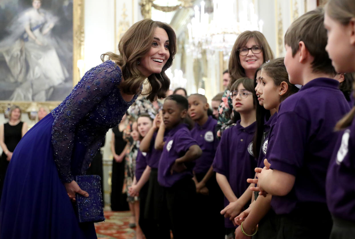 LONDON, ENGLAND - MARCH 09: Catherine, Duchess of Cambridge speaks with a school choir as she hosts a Gala Dinner in celebration of the 25th anniversary of Place2Be at Buckingham Palace on March 09, 2020 in London, England. The Duchess is Patron of Place2Be, which provides emotional support at an early age and believes no child should face mental health difficulties alone. (Photo by Chris Jackson - WPA Pool/Getty Images)