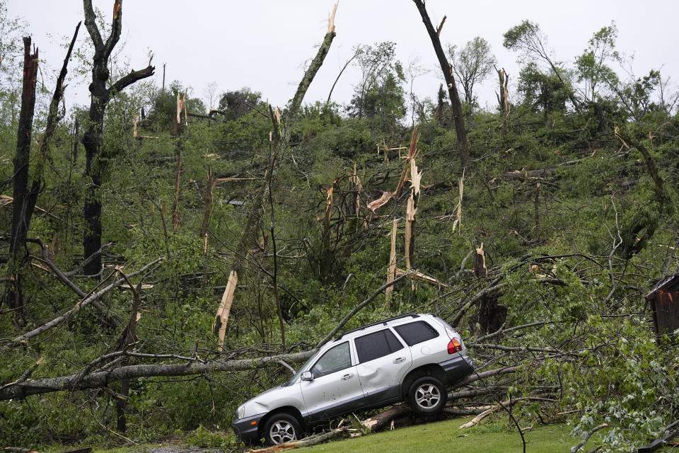 A storm damaged car is seen along Blackburn Road, Thursday, May 9, 2024, in Columbia, Tenn. Severe storms tore through the central and southeast U.S., Wednesday, spawning damaging tornadoes, producing massive hail, and killing two people in Tennessee. (AP Photo/George Walker IV)