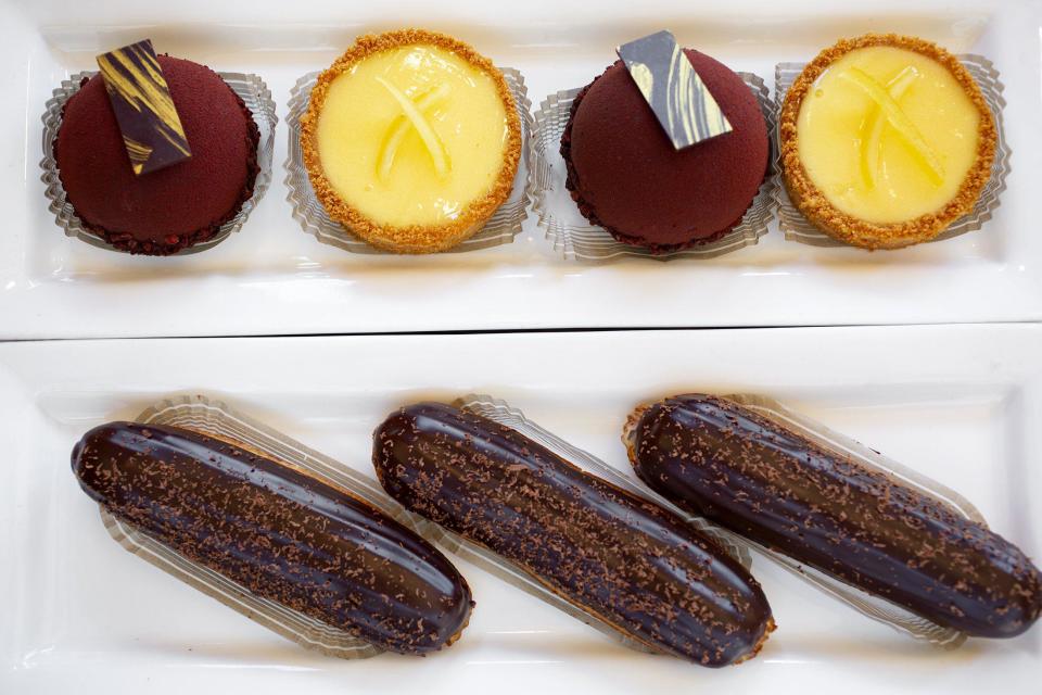 Classic eclairs, along with lemon tarts and chocolate bombes, at Pistacia Vera