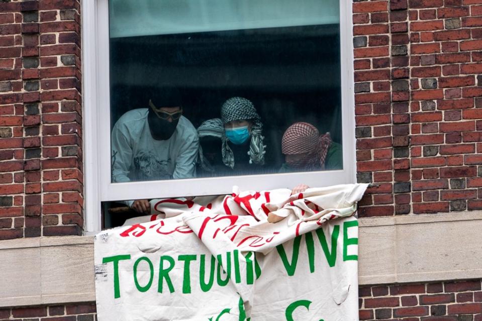 Carlson (far left) seen occupying Hamilton Hall. REUTERS