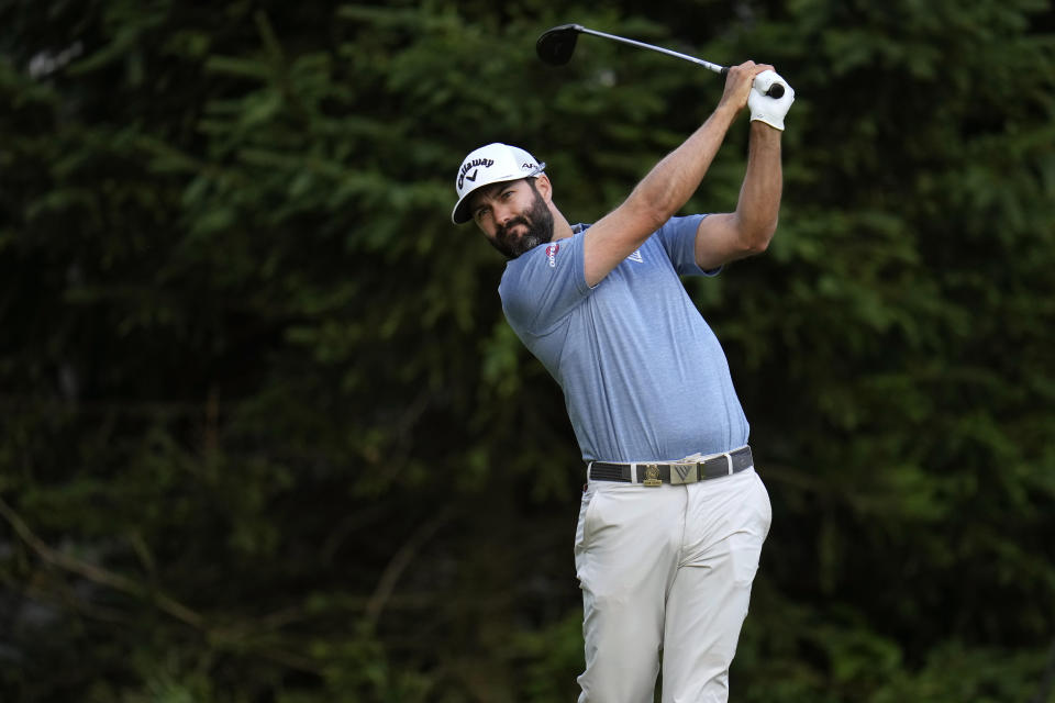 Adam Hadwin, of Canada, watches his shot on the 18th hole during the first round of the U.S. Open golf tournament at The Country Club, Thursday, June 16, 2022, in Brookline, Mass. (AP Photo/Julio Cortez)