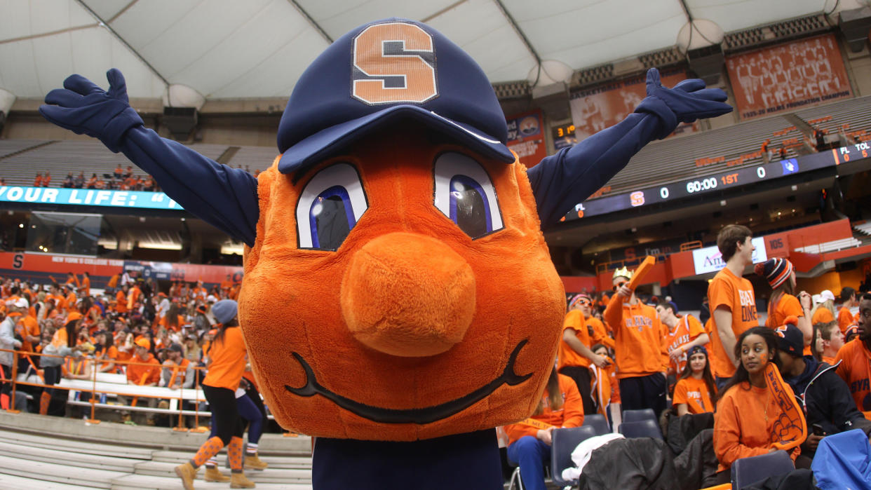 14 February 2015: Syracuse Orange mascot Otto the Orange cheers during ncaa basketball game between Duke Blue Devils and Syracuse Orange at the Carrier Dome in Syracuse, NY.