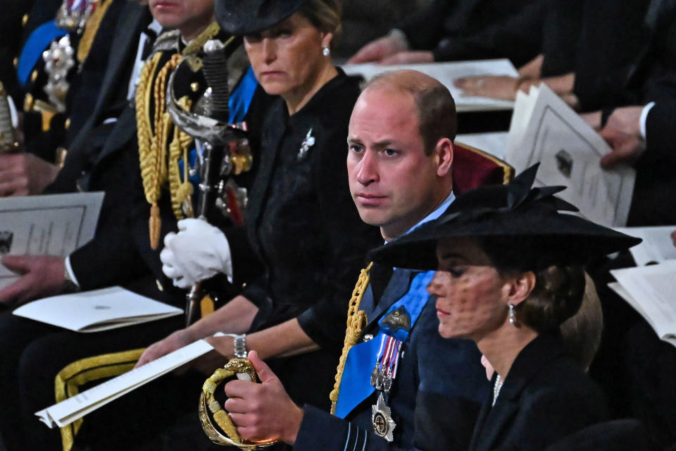 <p>LONDON, ENGLAND - SEPTEMBER 19: Prince William, Prince of Wales (C) attends the State Funeral Service for Britain's Queen Elizabeth II, at Westminster Abbey on September 19, 2022 in London, England. Elizabeth Alexandra Mary Windsor was born in Bruton Street, Mayfair, London on 21 April 1926. She married Prince Philip in 1947 and ascended the throne of the United Kingdom and Commonwealth on 6 February 1952 after the death of her Father, King George VI. Queen Elizabeth II died at Balmoral Castle in Scotland on September 8, 2022, and is succeeded by her eldest son, King Charles III. (Photo by Ben Stansall - WPA Pool/Getty Images)</p> 