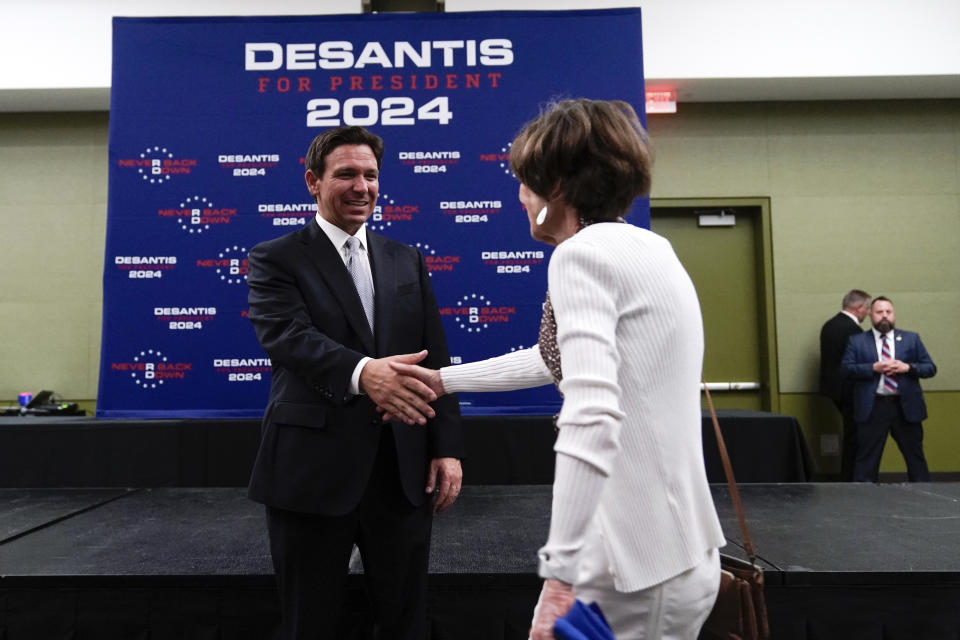 Republican presidential candidate Florida Gov. Ron DeSantis greets supporters at the Republican Party of Iowa's 2023 Lincoln Dinner in Des Moines, Iowa, Friday, July 28, 2023. (AP Photo/Charlie Neibergall)