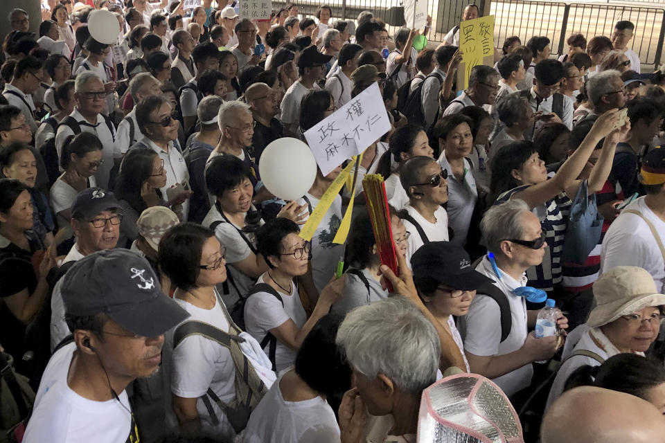 Elderly Hong Kong residents march in Hong Kong on Wednesday, July 17, 2019. Some 2,000 Hong Kong senior citizens, including a popular actress, marched Wednesday in a show of support for youths at the forefront of monthlong protests against a contentious extradition bill in the semi-autonomous Chinese territory.(AP Photo/Phoebe Lai)