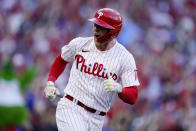 Philadelphia Phillies first baseman Rhys Hoskins (17) celebrates after hitting a three-run home run during the third inning in Game 3 of baseball's National League Division Series against the Atlanta Braves, Friday, Oct. 14, 2022, in Philadelphia. (AP Photo/Matt Rourke)
