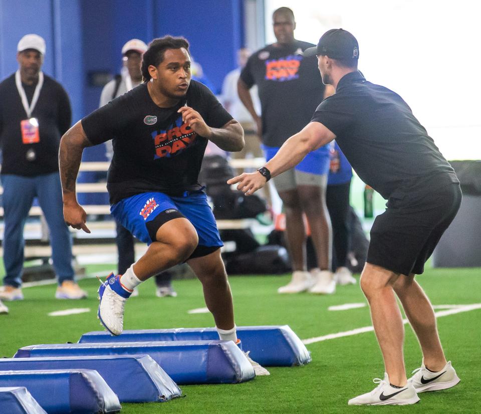 Florida offensive lineman Kingsley Eguakun runs through a drill during Gator Pro Day 2024 Thursday March 21, 2024. On-Field Drills were held in the Condron Indoor Practice Facility. Athletes performed broad Jump; 40-yard dash; Pro Shuttle L Drill. On-Field Position Workouts included WR/TE/RB, QB, OL. The annual event was held at Condron Indoor Practice Facility in Gainesville, FL on Thursday, March 21, 2024. [Doug Engle/Gainesville Sun]