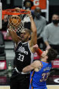 Los Angeles Clippers forward Nicolas Batum (33) dunks the ball against Oklahoma City Thunder center Mike Muscala (33) during the first quarter of an NBA basketball game Sunday, Jan. 24, 2021, in Los Angeles. (AP Photo/Ashley Landis)