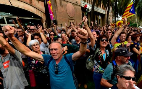 People celebrate after Catalonia's parliament voted to declare independence from Spain on October 27, 2017 - Credit:  PIERRE-PHILIPPE MARCOU